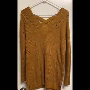 Pink rose light brownish colored sweater with twist design in back size large.